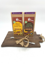 Load image into Gallery viewer, This simple but thoughtfully gathered gift hamper from the Gathered Bowl contains one wooded chopping Board, Almond and seed Cracker Mix, Seed and Rosemary Cracker Mic and a Cheese knife. A perfect gift for the special foodie in your life. The crackers are also keto. All of our packaging is 100% home compostable which makes this the perfect zero waste gift.
