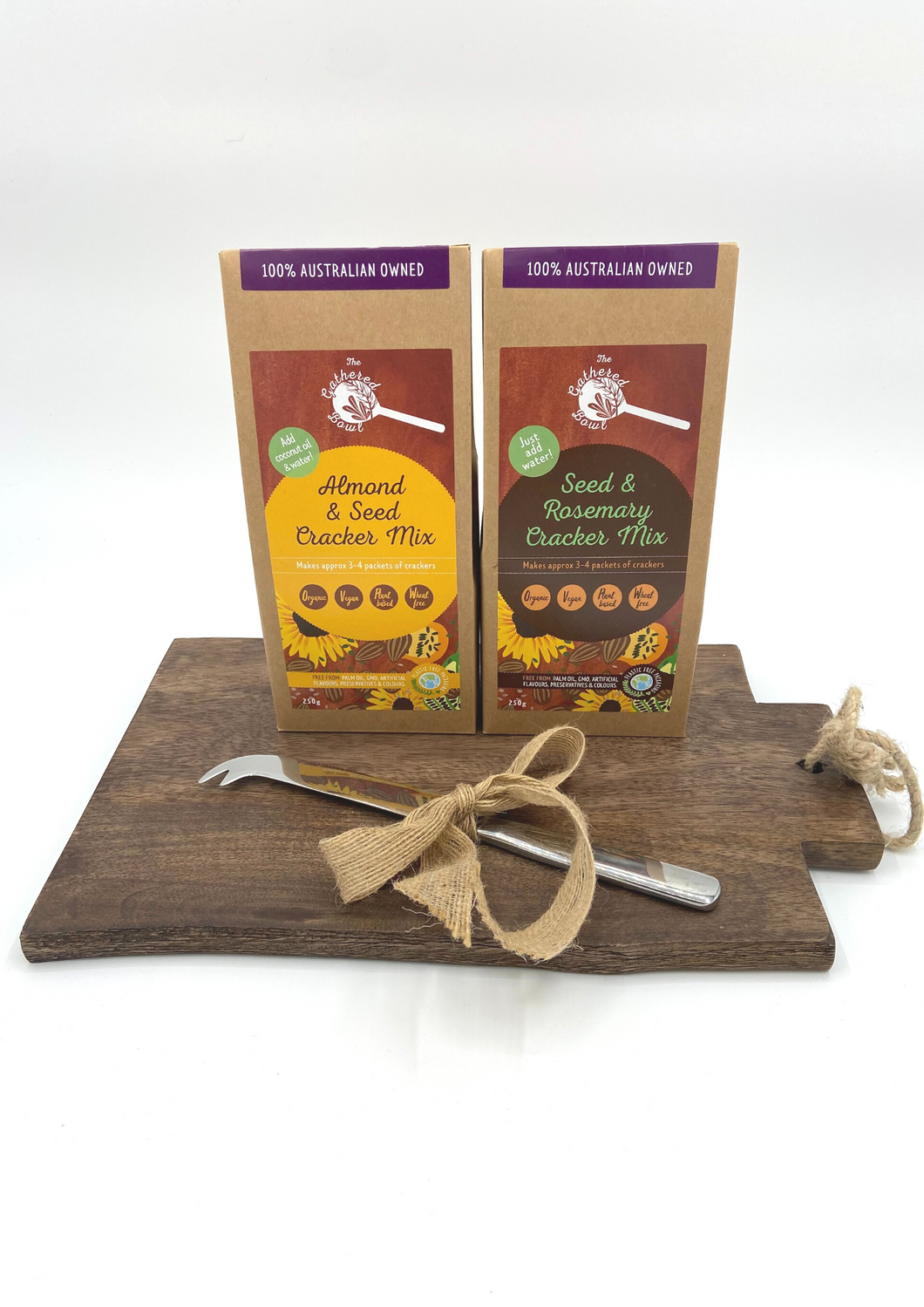 This simple but thoughtfully gathered gift hamper from the Gathered Bowl contains one wooded chopping Board, Almond and seed Cracker Mix, Seed and Rosemary Cracker Mic and a Cheese knife. A perfect gift for the special foodie in your life. The crackers are also keto. All of our packaging is 100% home compostable which makes this the perfect zero waste gift.