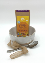 Load image into Gallery viewer, Small Gift Hamper containing The Gathered Bowl Pattie Mix of your choice a glazed cream ceramic bowl and Metal spoon. Everything the special foodie in your life needs to make our Pattie Mix so it&#39;s ready to use. Our Mixes are vegan, plantbased, organic, wholefoods, full of plant protein and very easy to make. All of our packaging can be placed in your home compost bin even the inner liner. 
